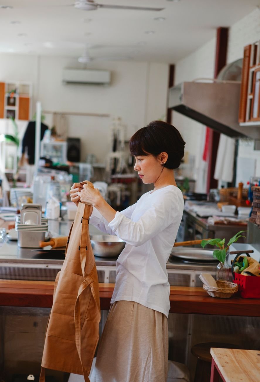 Restaurant owner at work in a warm, inviting kitchen setting